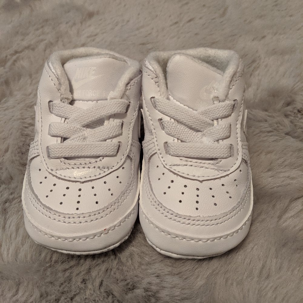 Baby white Nikes size 1